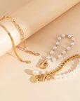 Chic Gold 4-Piece Bracelet Set – Snake, Pearls & Links | Gold